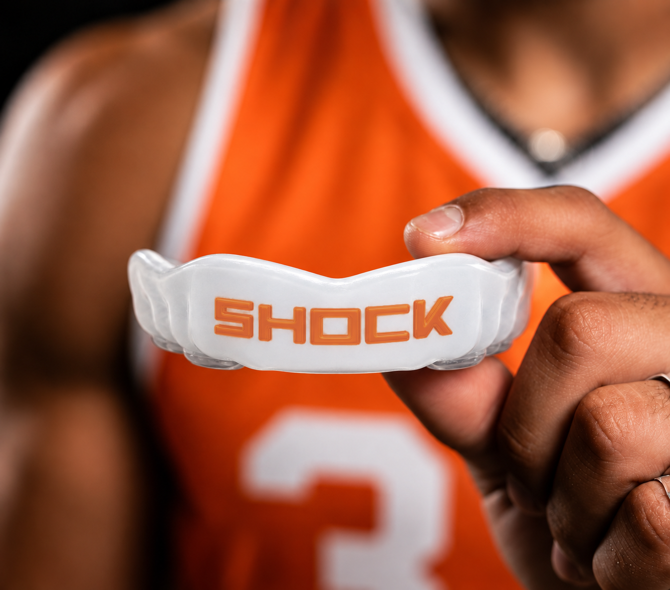 Athlete holding a Shock Doctor custom mouthguard
